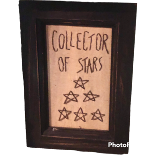 Framed sign that says Collector of Stars.