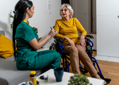 Occupational therapist talking to lady
