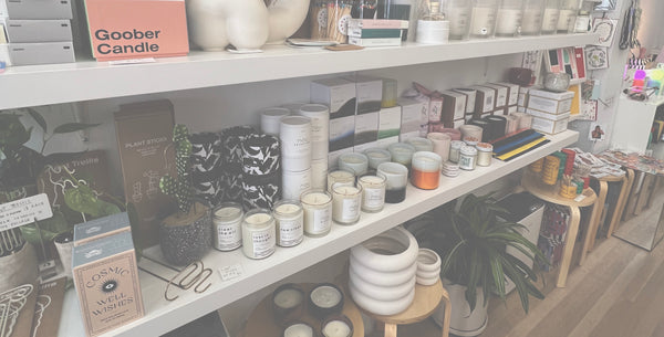 image of postmodernform candles on a store shelf amongst other products