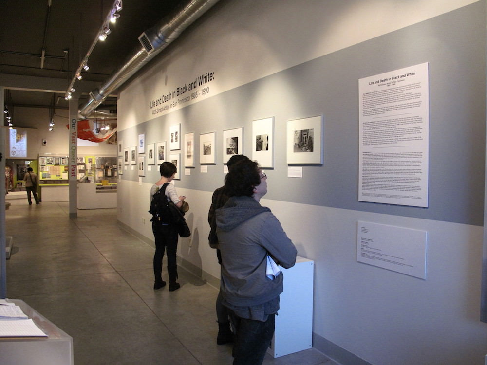 People walking inside of an art museum