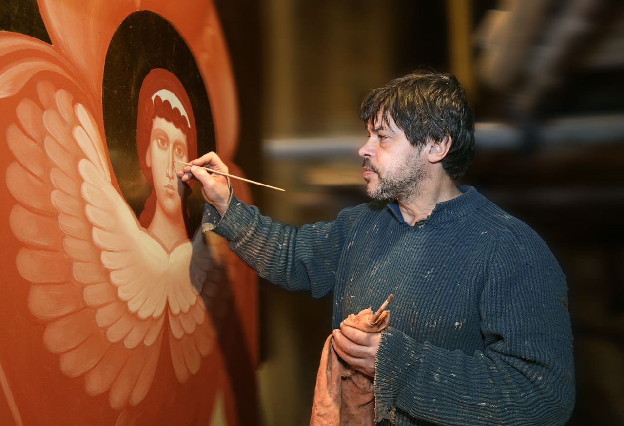Artist painting an angel