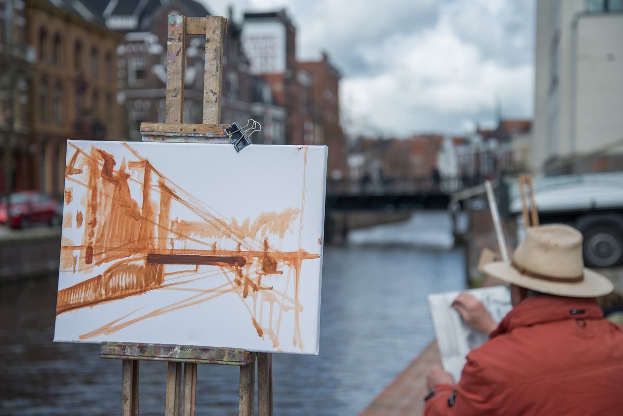 Traditional painting of a bridge over a canal