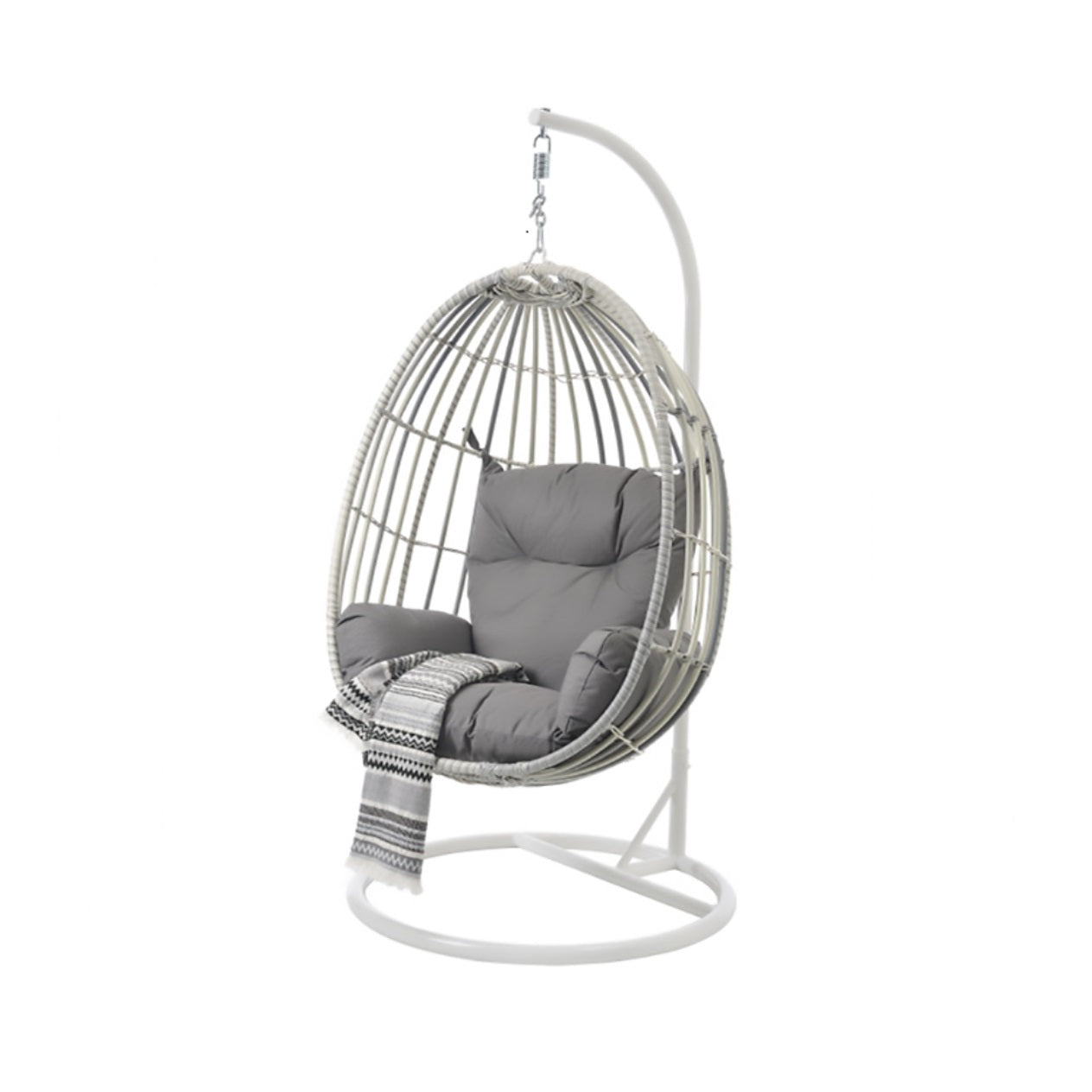 The Kannis Hanging Chair featuring a sleek white metal frame and woven details, complete with cozy gray cushions and a patterned throw blanket, suspended from a curved stand.