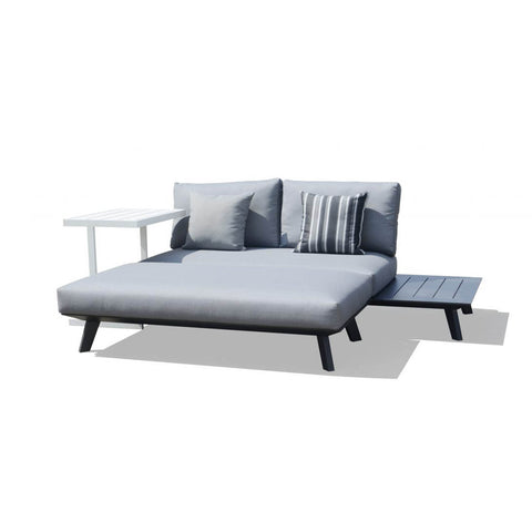 Positano aluminium outdoor furniture set featuring outdoor chairs, outdoor lounge, ottoman, and daybed in charcoal and white colors with a couch and a table on a white background.