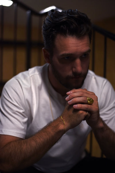 Lion Ring Gold on Michael Schook wearing MVDT T-shit white.