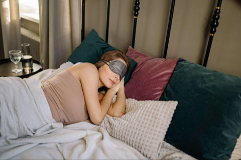 woman sleeping with an eye mask