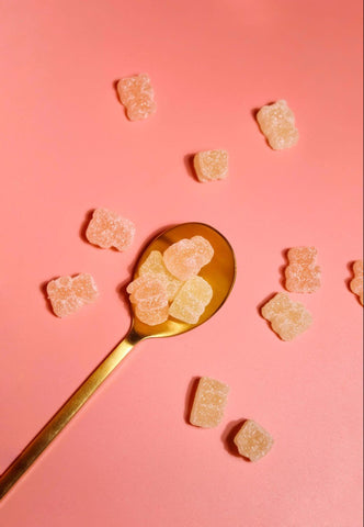 fitness gummies on a spoon