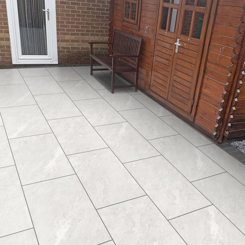 White porcelain paving slabs. Porcelain paving slabs next to back door.