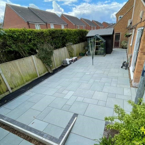 Blue limestone paving. Limestone paving patio in back garden.