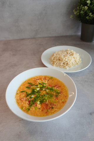 Kimchi tomato soup in bowl with rice