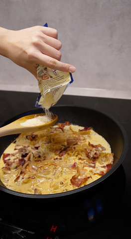 Adding parmesan to pan