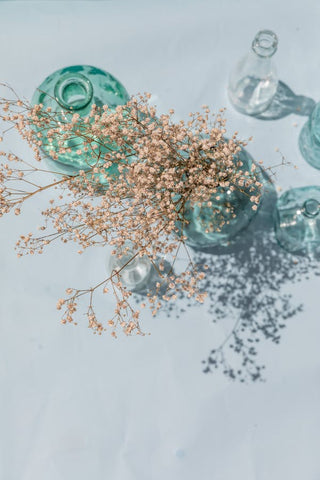 dried flowers in wine bottle