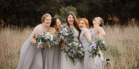 Bride and bridesmaids in field showcasing Atelier Blooms handcrafted paper flower bouquets. wedding-bouquet-Atelier Blooms Auckland.