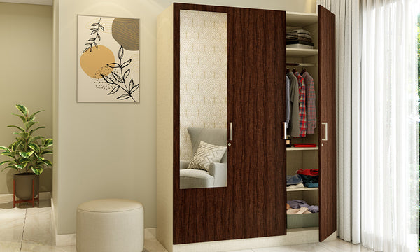 Swing door wardrobe with multiple shelves, hanging rods, and drawers for organised storage.