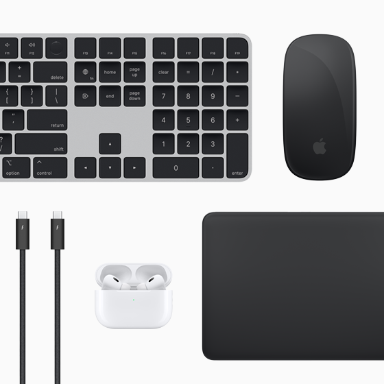 Vista superior de los accesorios para el Mac: Magic Keyboard, Magic Mouse, Magic Trackpad, AirPods y cables Thunderbolt