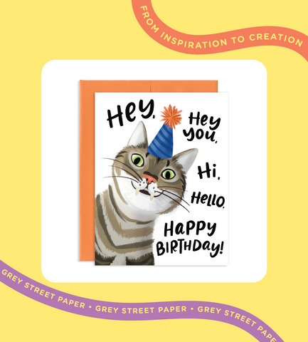blog post header. from inspiration to creation. Birthday greeting card with an orange envelope. Greeting card is an illustration of a cat that says hey, hey you, hi, hello, happy birthday.