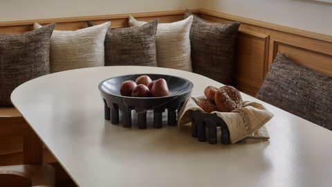 Black marble decorative stone bowl on a breakfast nook table