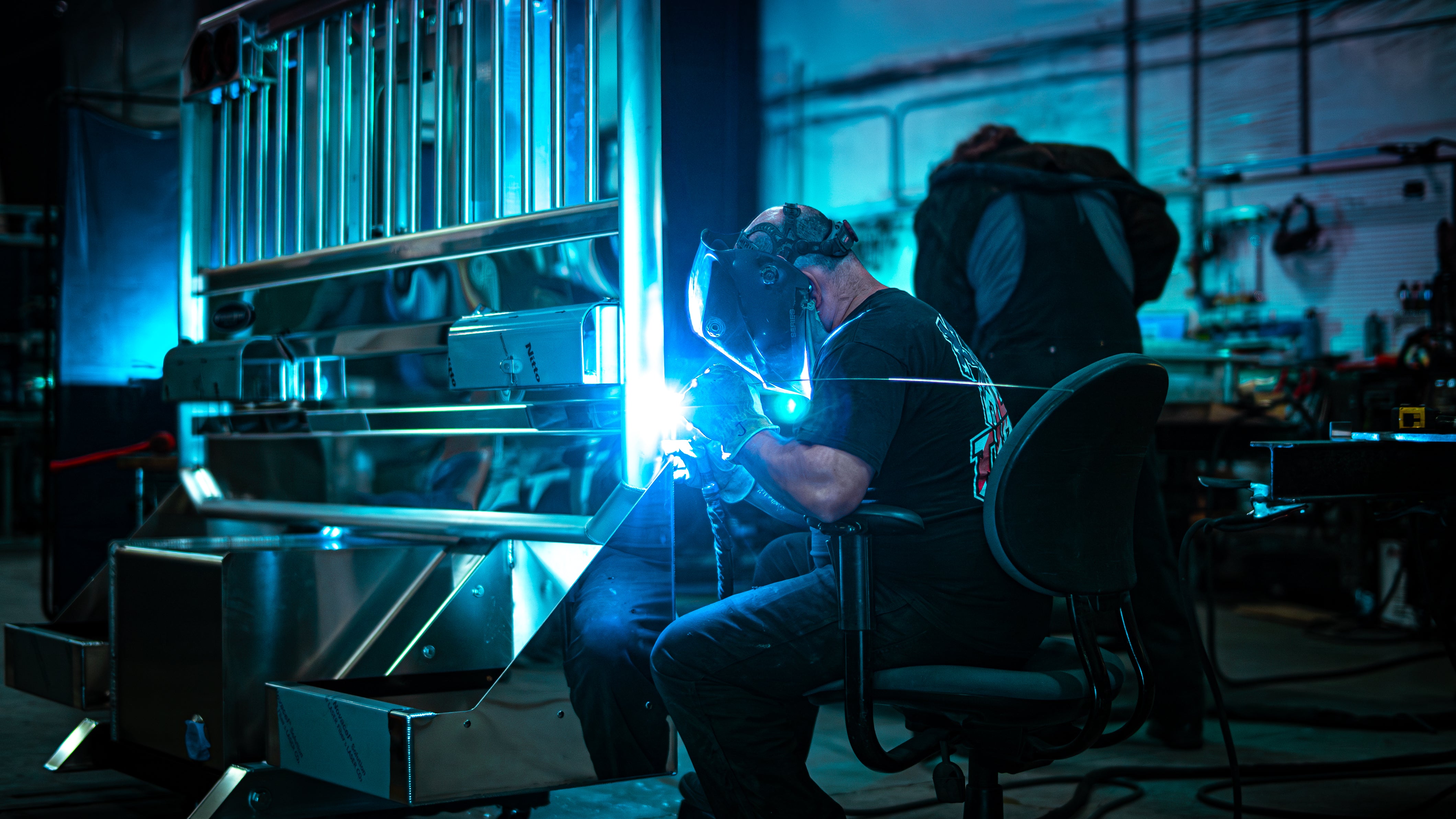 Welder welding Class 8 Cab Rack