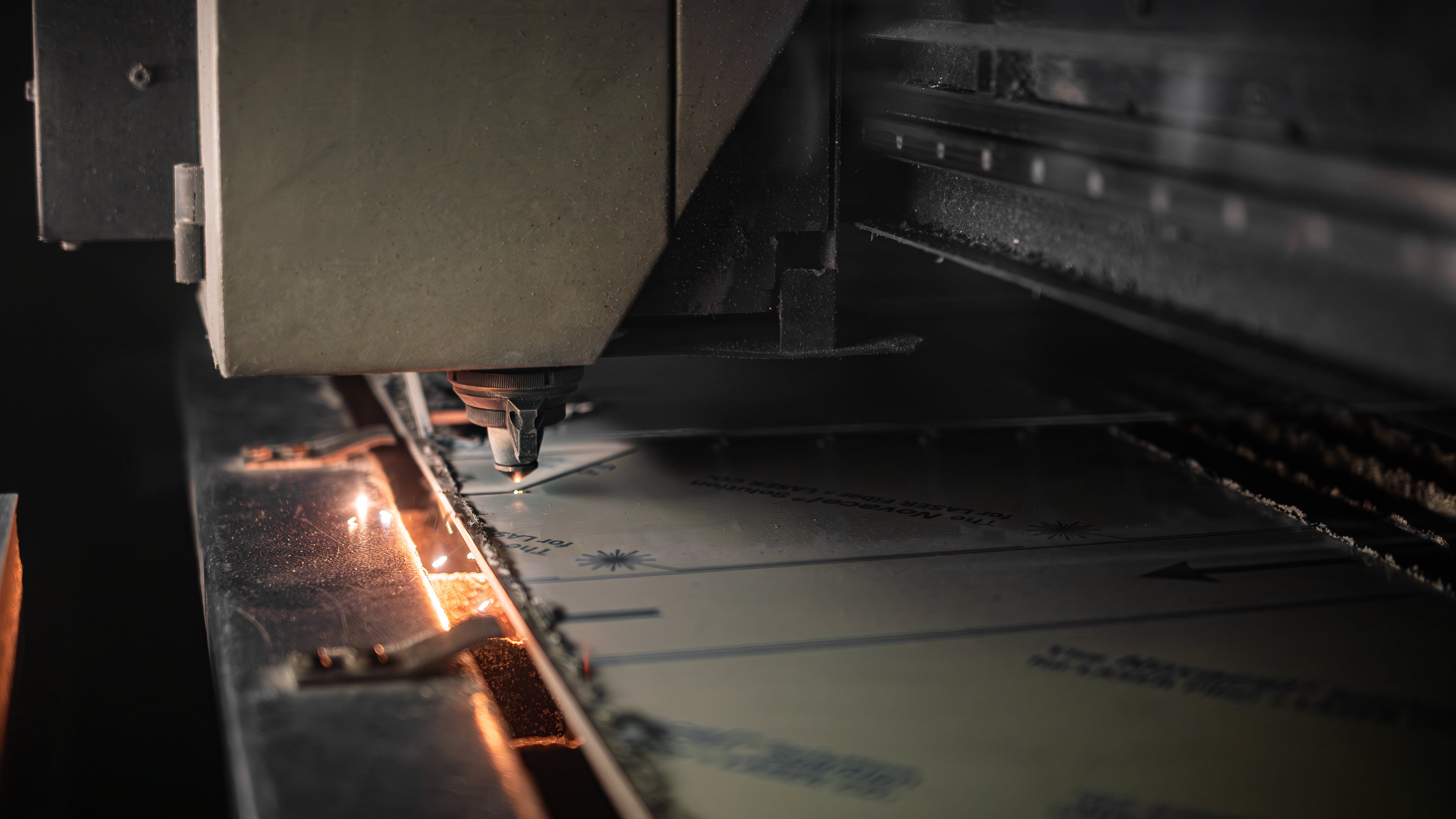 Close up of laser cutter cutting aluminum sheets