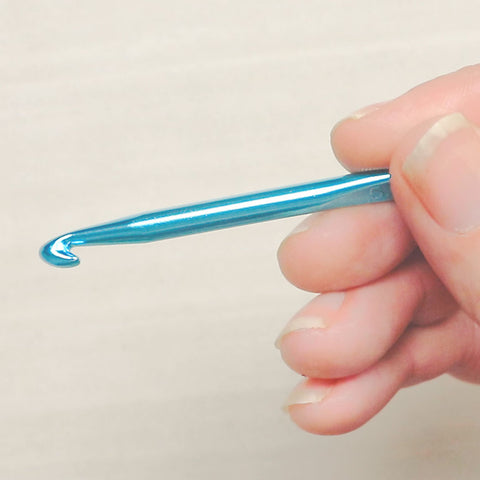 Holding a crochet hook like a pencil