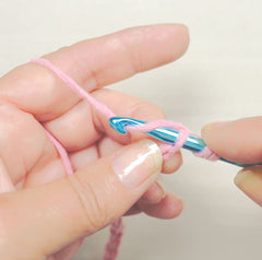 Double crochet - step 3 - yarn over and pull up a loop