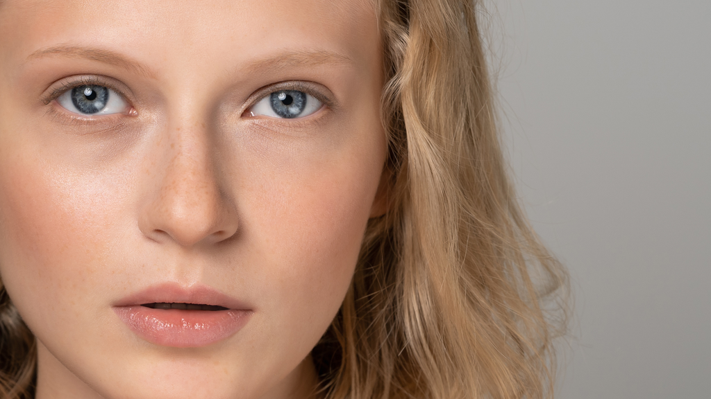 model looking at camera under eye skin care