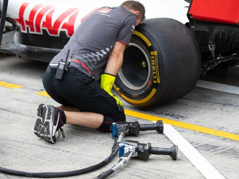 02-A man is checking the race tires
