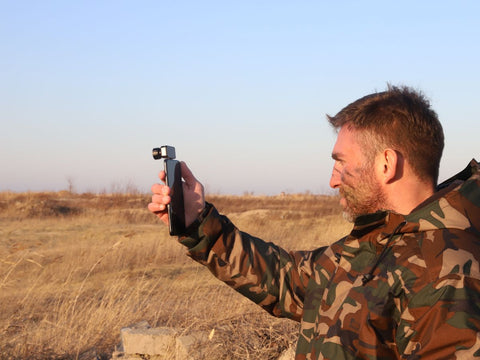 03 A seasoned hunter is using a thermal monocular
