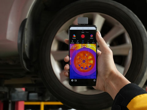 05 Automotive professionals inspect tires using thermal imaging technology