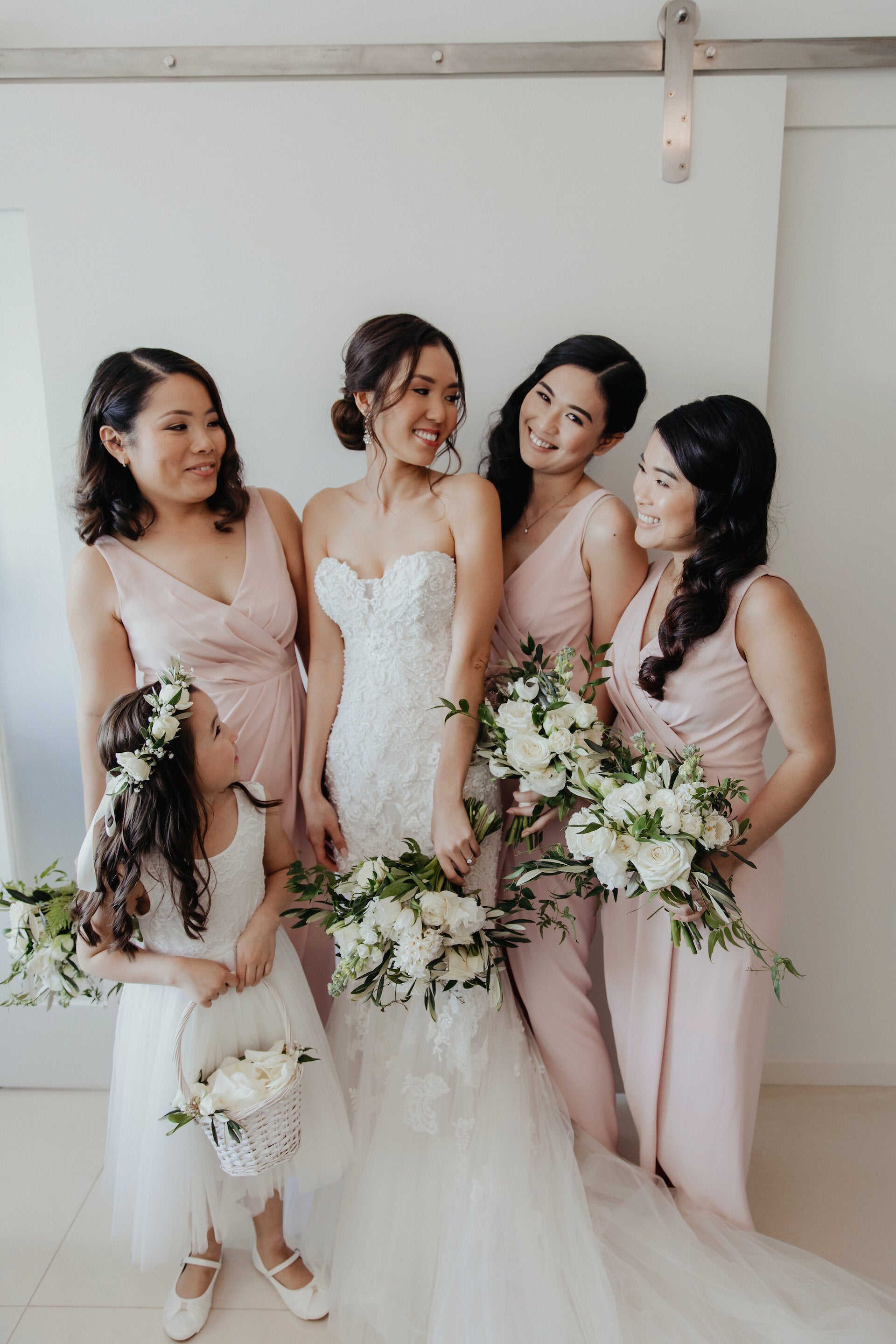 Beautiful bride, bridesmaids and flower girl with their flowers, Darwin.