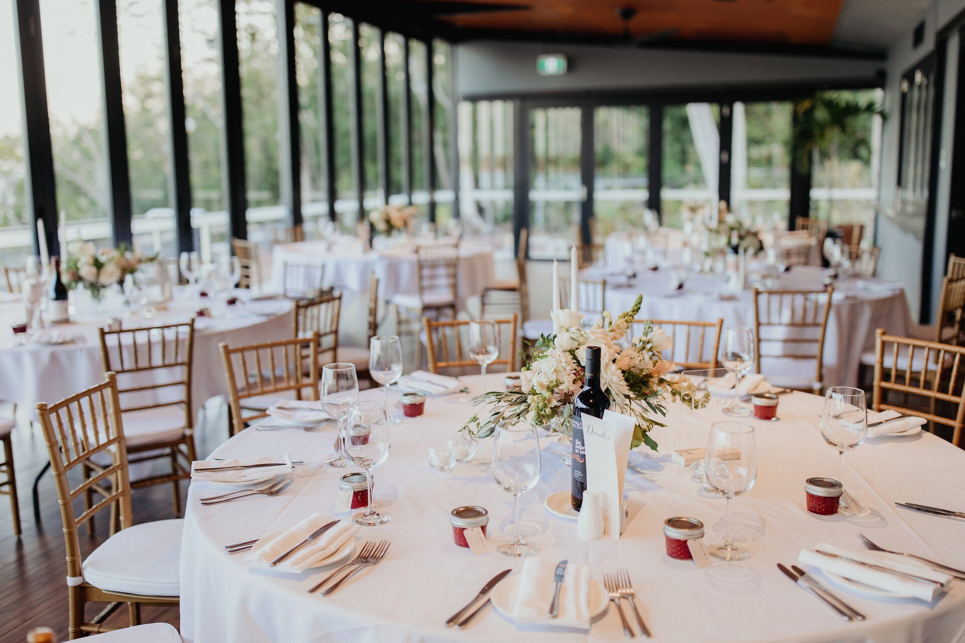 Crystal bowls filled with fragrant flowers and crystal candleholders for a wedding reception at Pee Wees, Darwin.