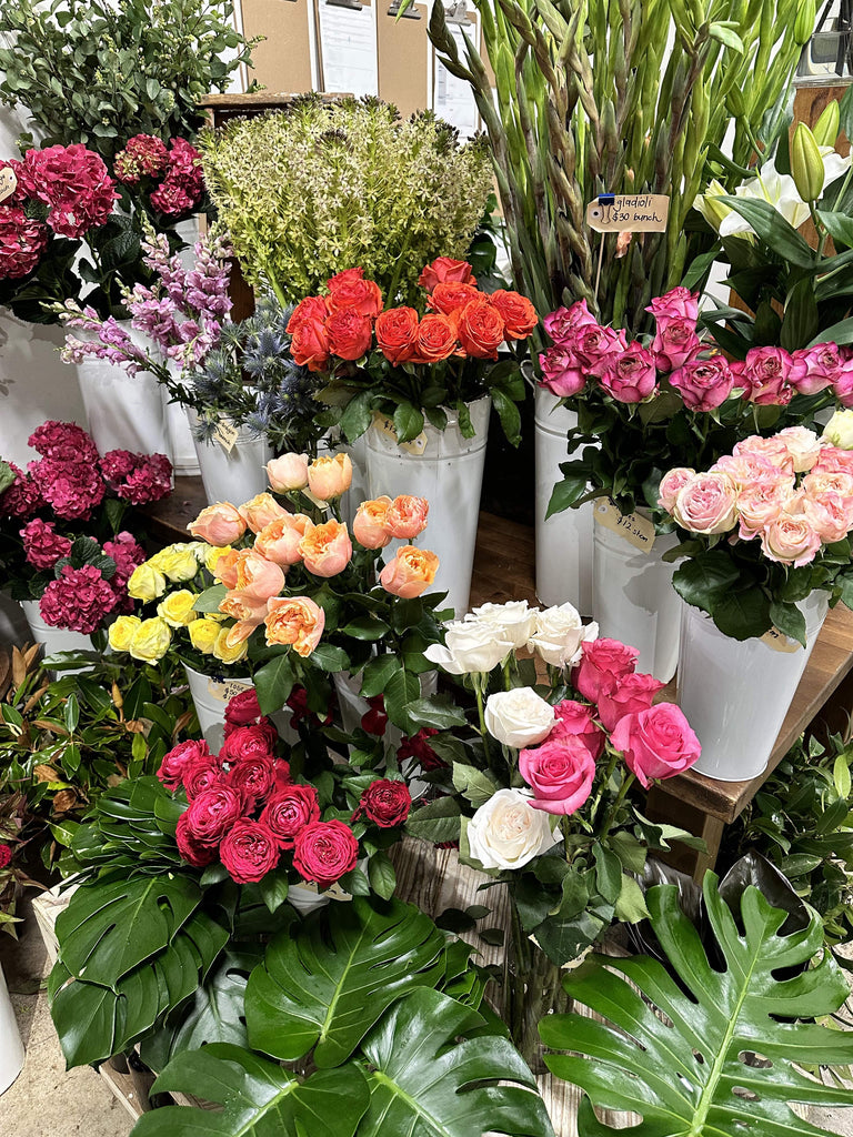 inside the beija flor shop a bunch of roses in different colours