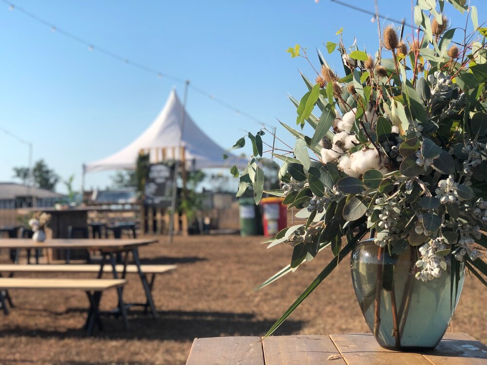 Statement vase at festival themed event with cotton and eucalyptus