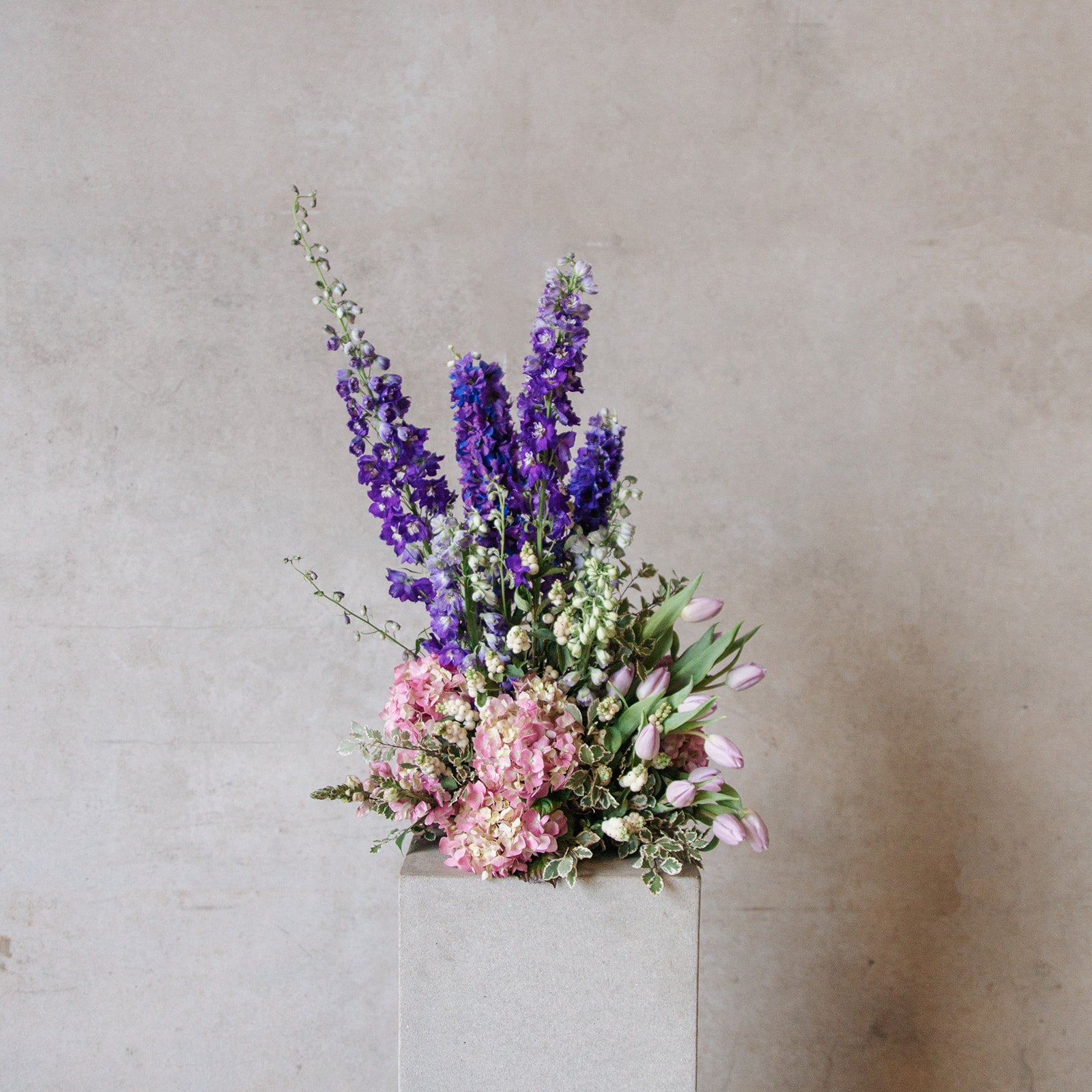 Statement floral arrangement in white green and purple colour