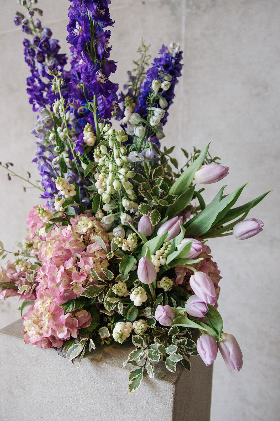 Statement floral arrangement in white green and purple colour - side view