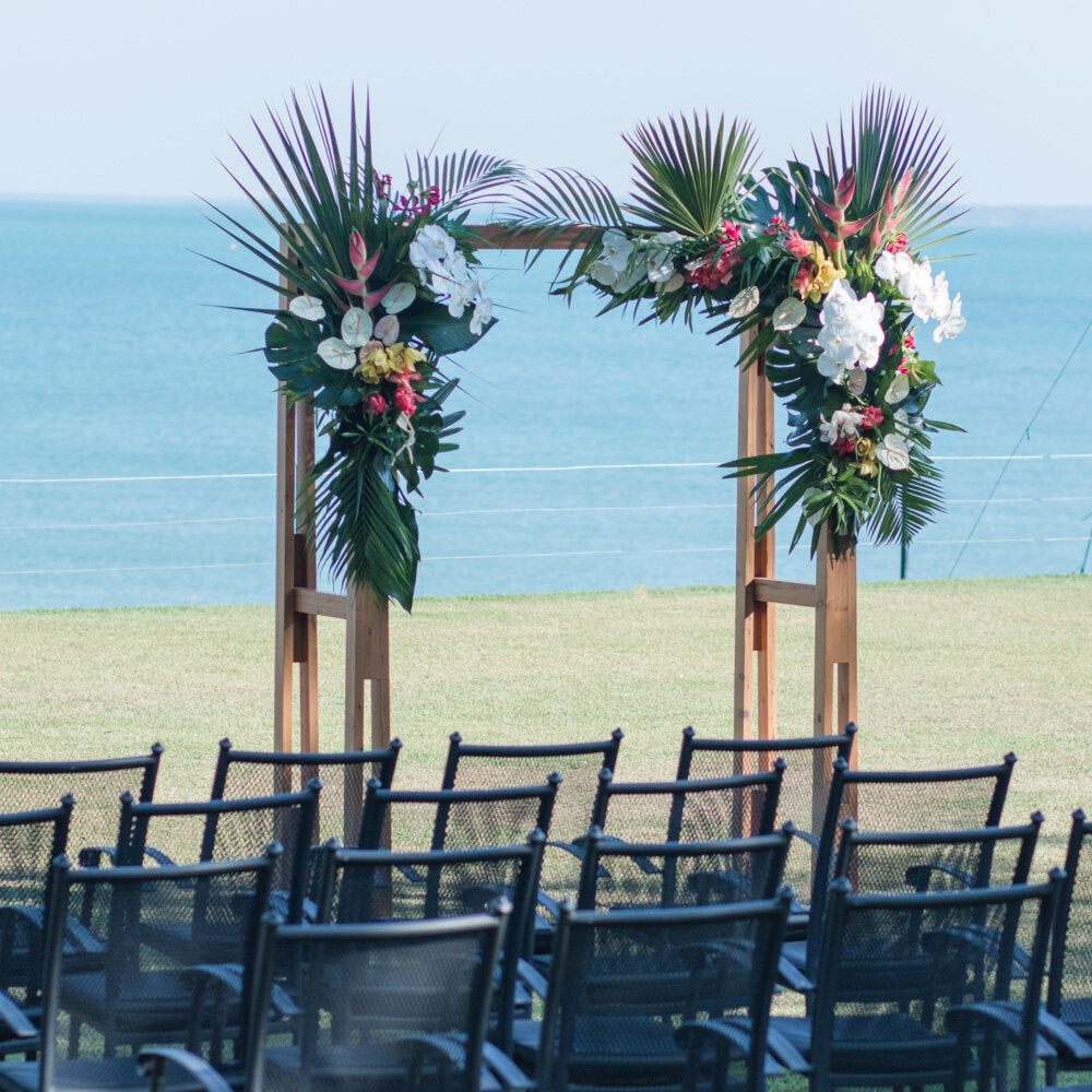 a row of chairs sitting next to each other in front of an ocean with beija flor arbour