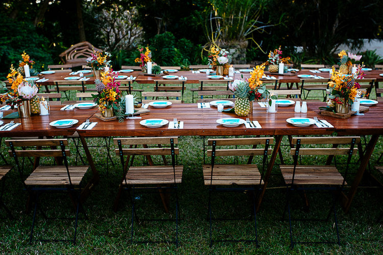 timber table tops with pineapples and flowers at Darwin Botanic Gardens