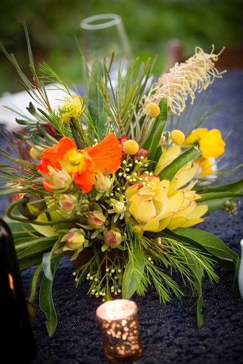 poppies, native flowers including grevillea and leucodendren for table centrepieces