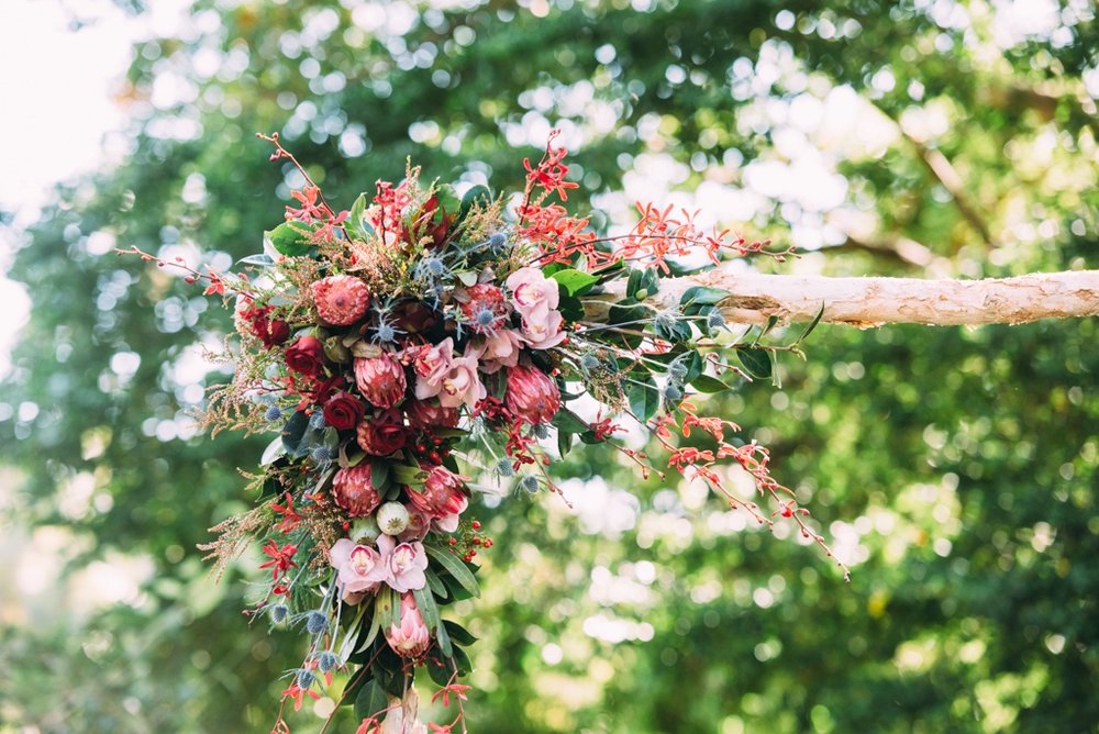 native flowers adorn a paperbark arbour at Darwin wedding