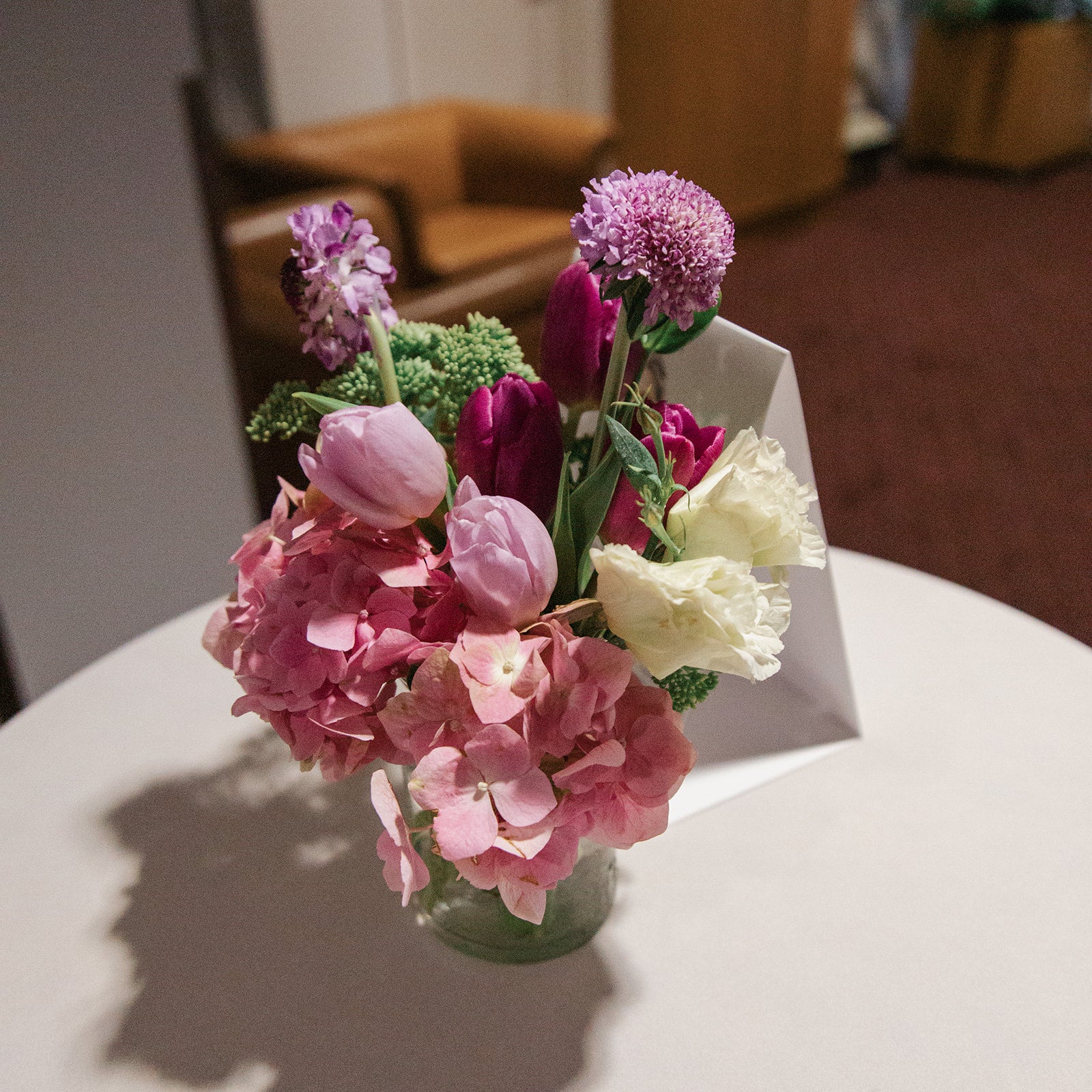 a vase filled with flowers on top of a table