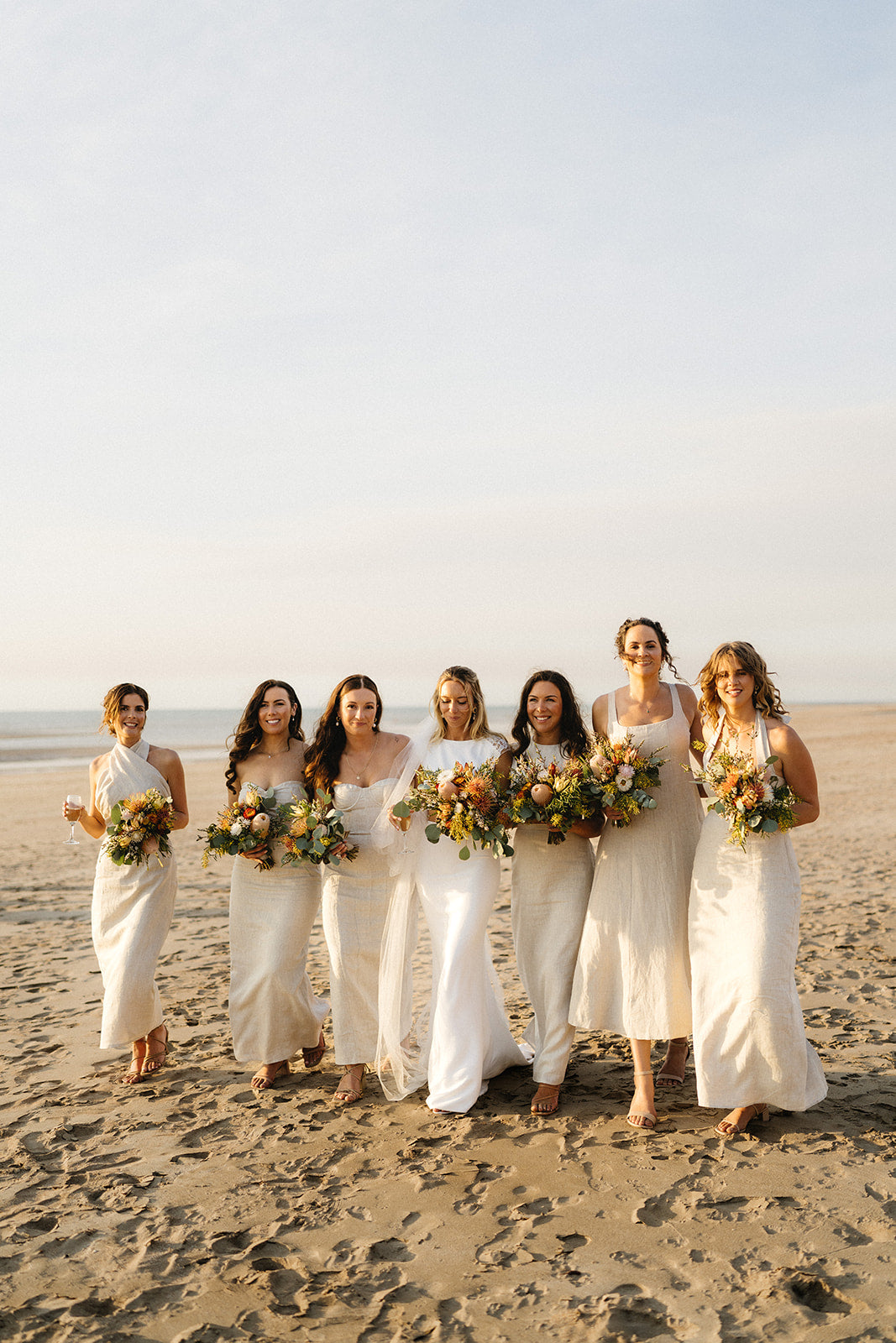 Hannah & Austin - Beija Flor Real Wedding - Bride and Bridesmaid at the beach