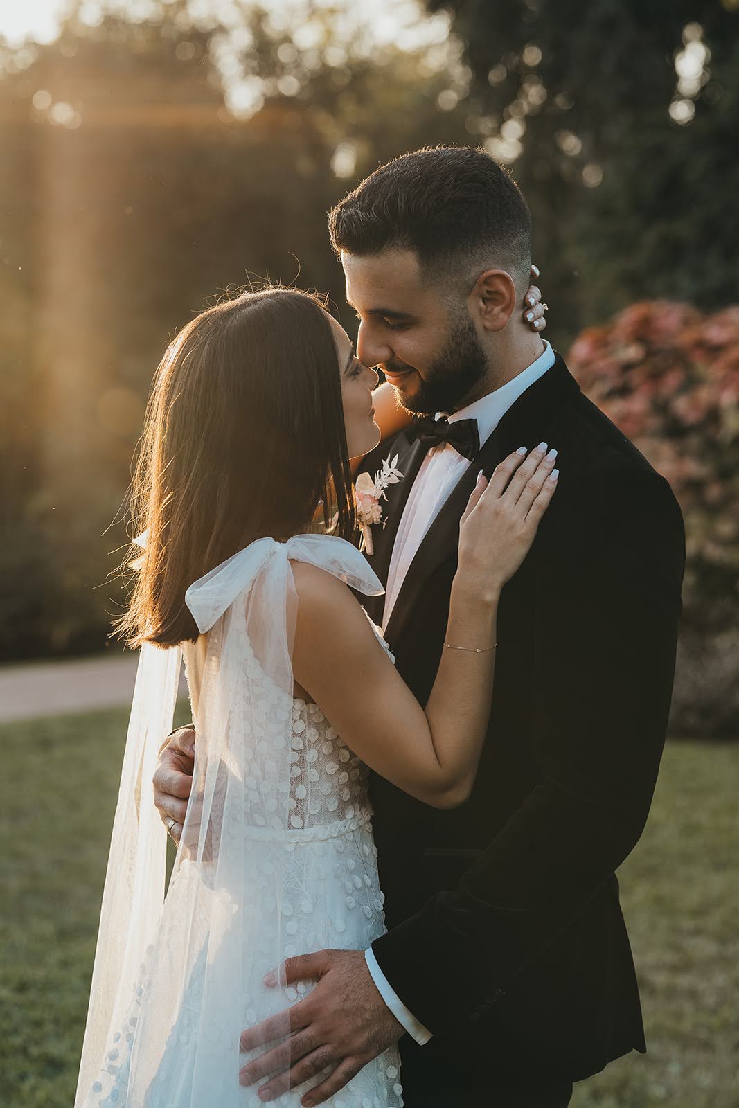 Mel and Paul - Beija Flor Real Wedding - Bride and Groom Kissing in A Field