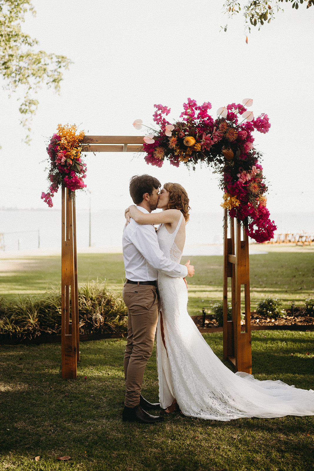 Naomi and Jack - Beija Flor Real Wedding - Bride and Groom Under the Wedding Arbour