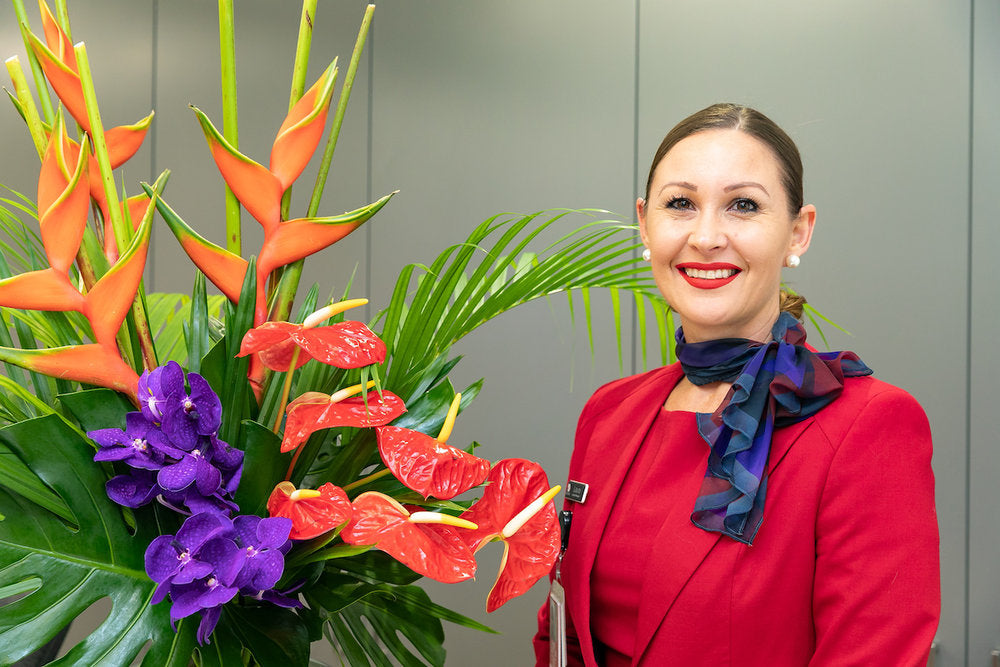 Red and purple tropical flowers complement Virgin branding.