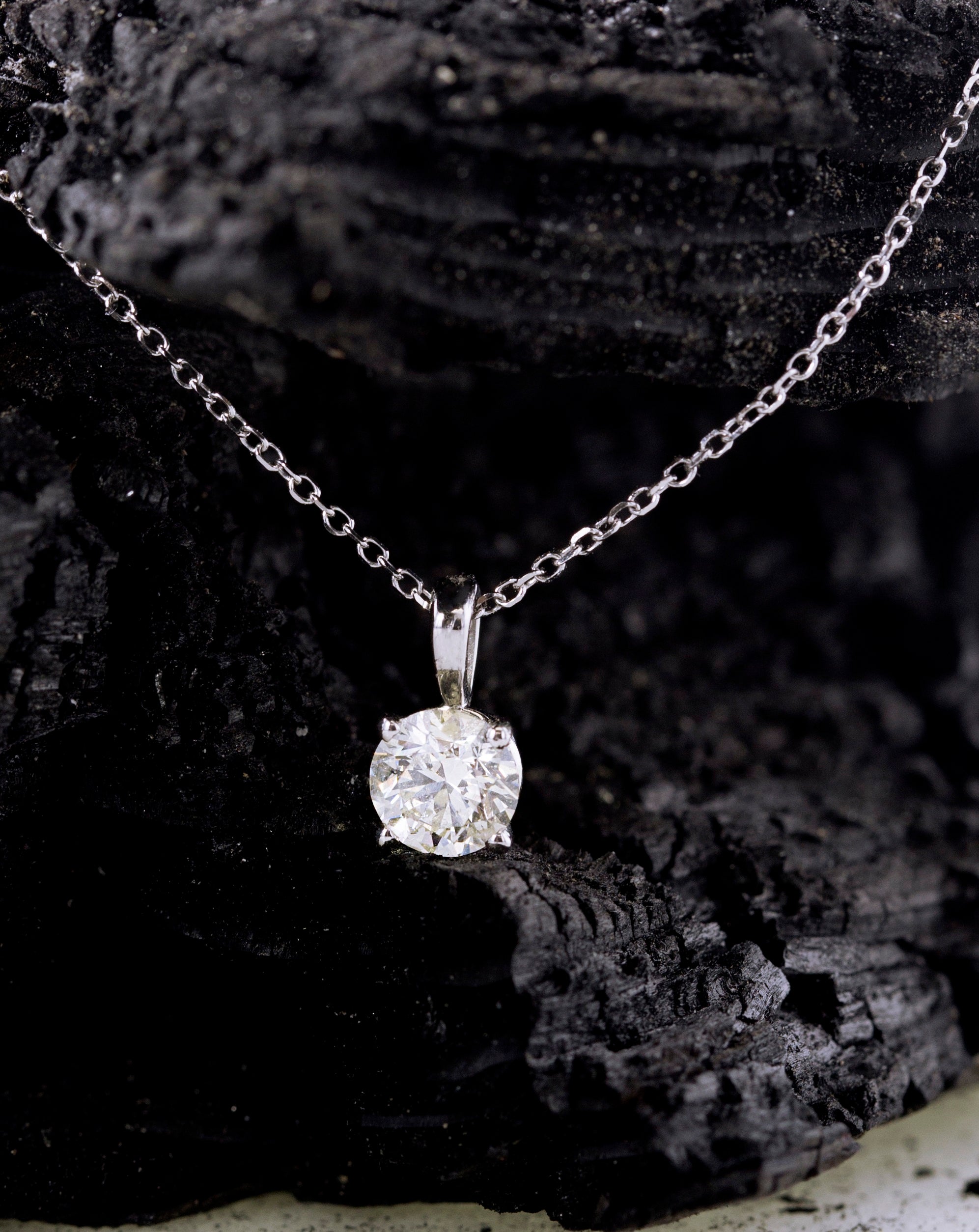 A natural earth born diamond set into a pendant on a necklace.