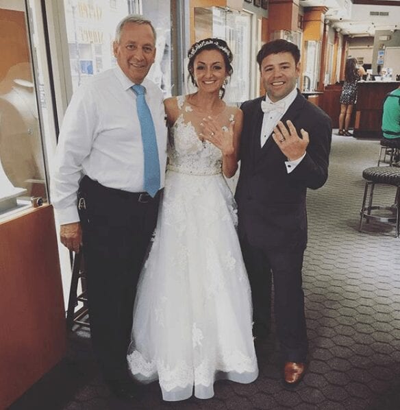 Greg with a newly married couple.