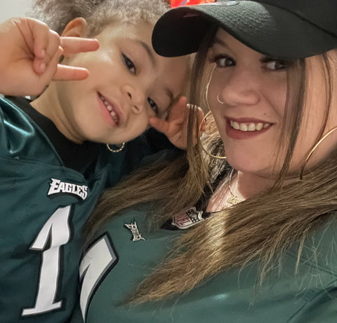 Steven Singer Jeweler, Jen with wearing Eagles jersey with daughter