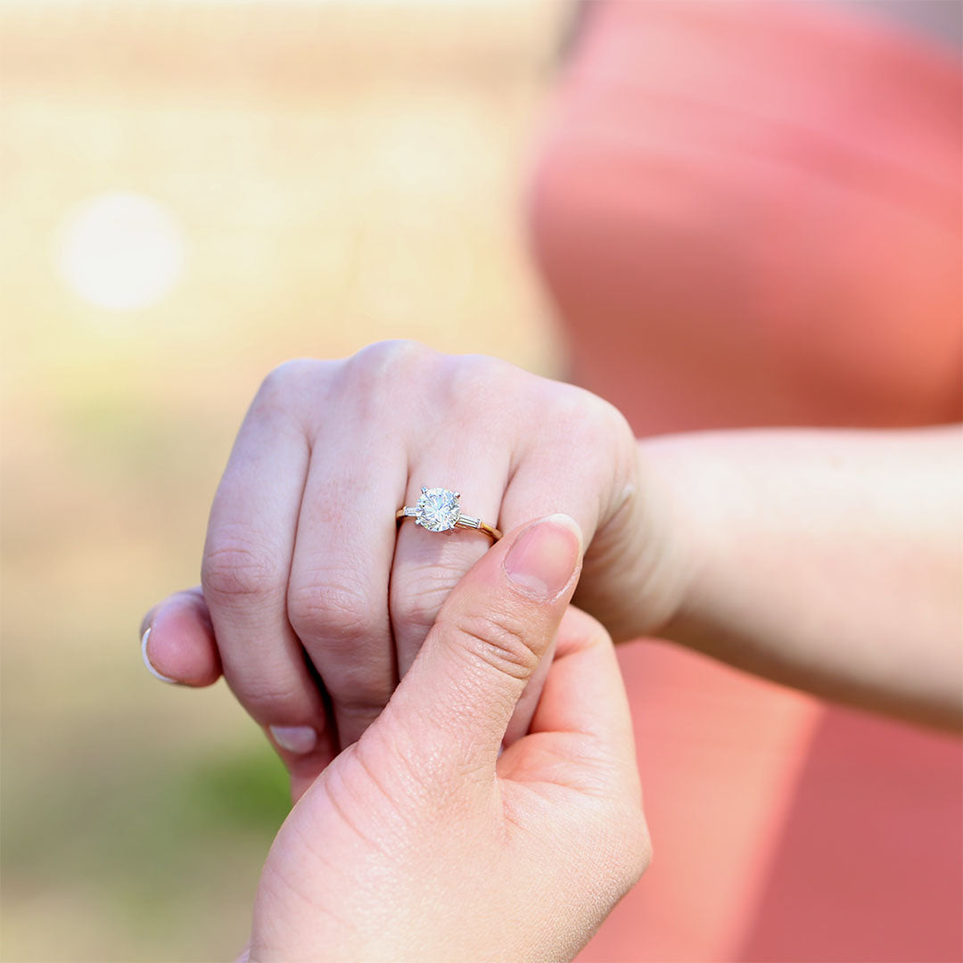 A pretty one stone yellow gold engagement ring.