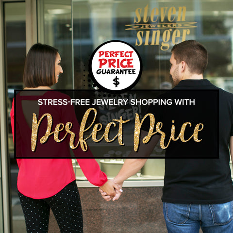 A couple shops in front of Steven Singer Jewelers. Stress-free Jewelry Shopping with Steven Singer's Perfect Price Guarantee