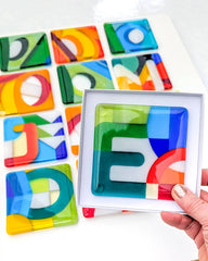 Commissioned glass art alphabet coasters as gifts